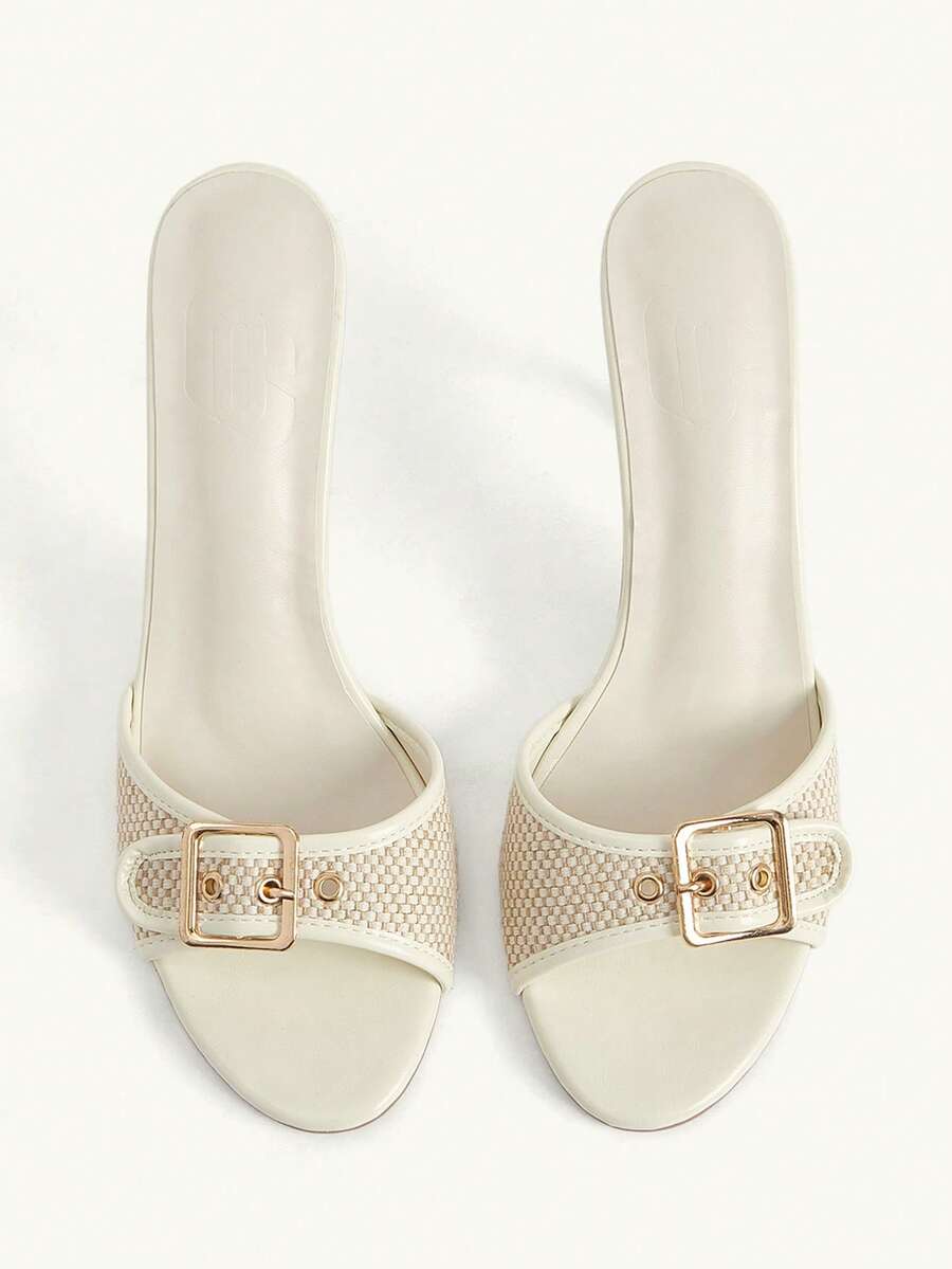 Women's brown leopard print high heel mule sandals with gold-tone buckle and grommet eyelet accents.