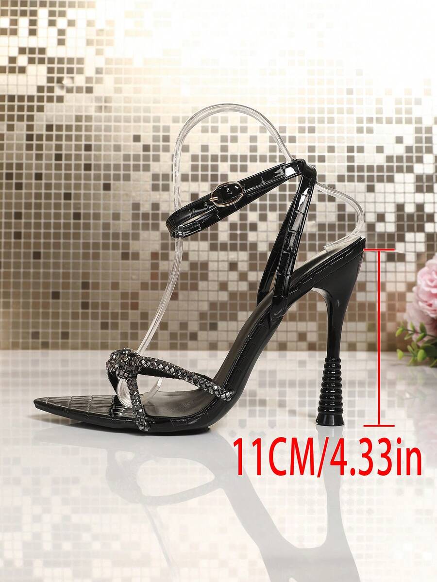 Women's peep toe stiletto high heel strappy sandals with rhinestone accents and slip-on design.