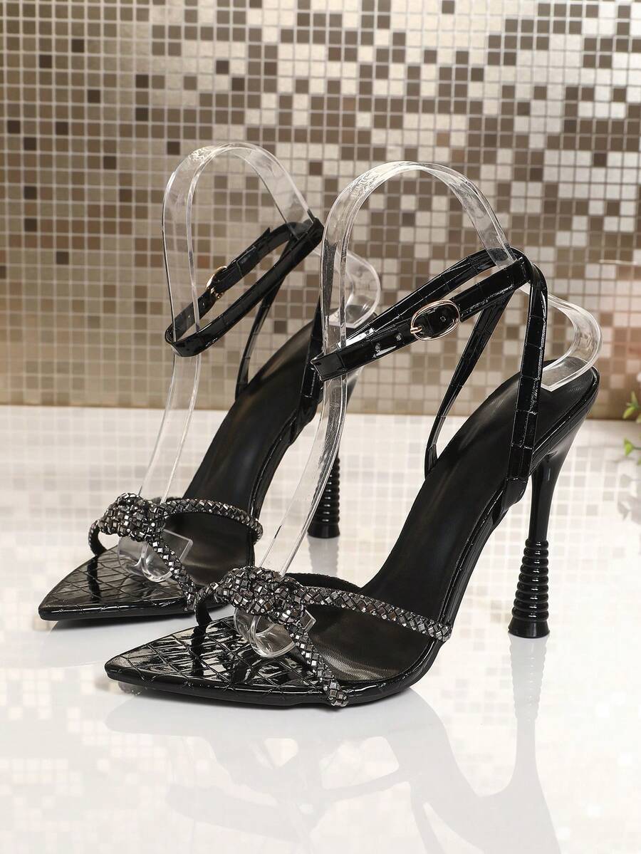 Women's peep toe stiletto high heel strappy sandals with rhinestone accents and slip-on design.
