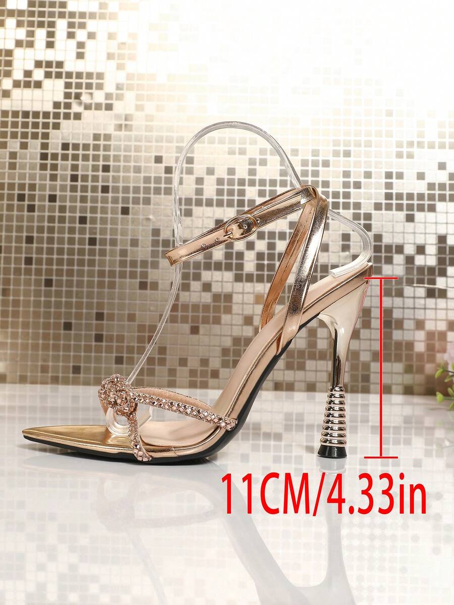Women's peep toe stiletto high heel strappy sandals with rhinestone accents and slip-on design.