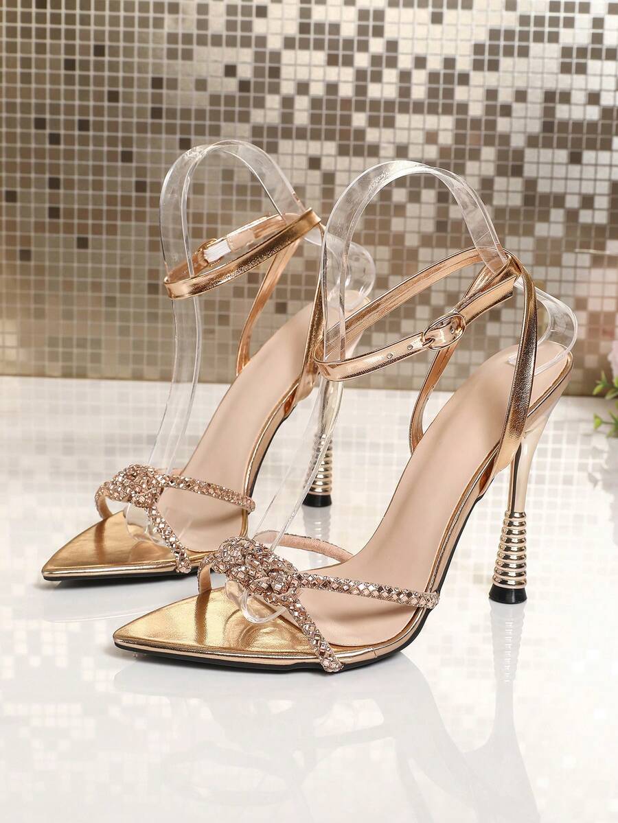 Women's peep toe stiletto high heel strappy sandals with rhinestone accents and slip-on design.