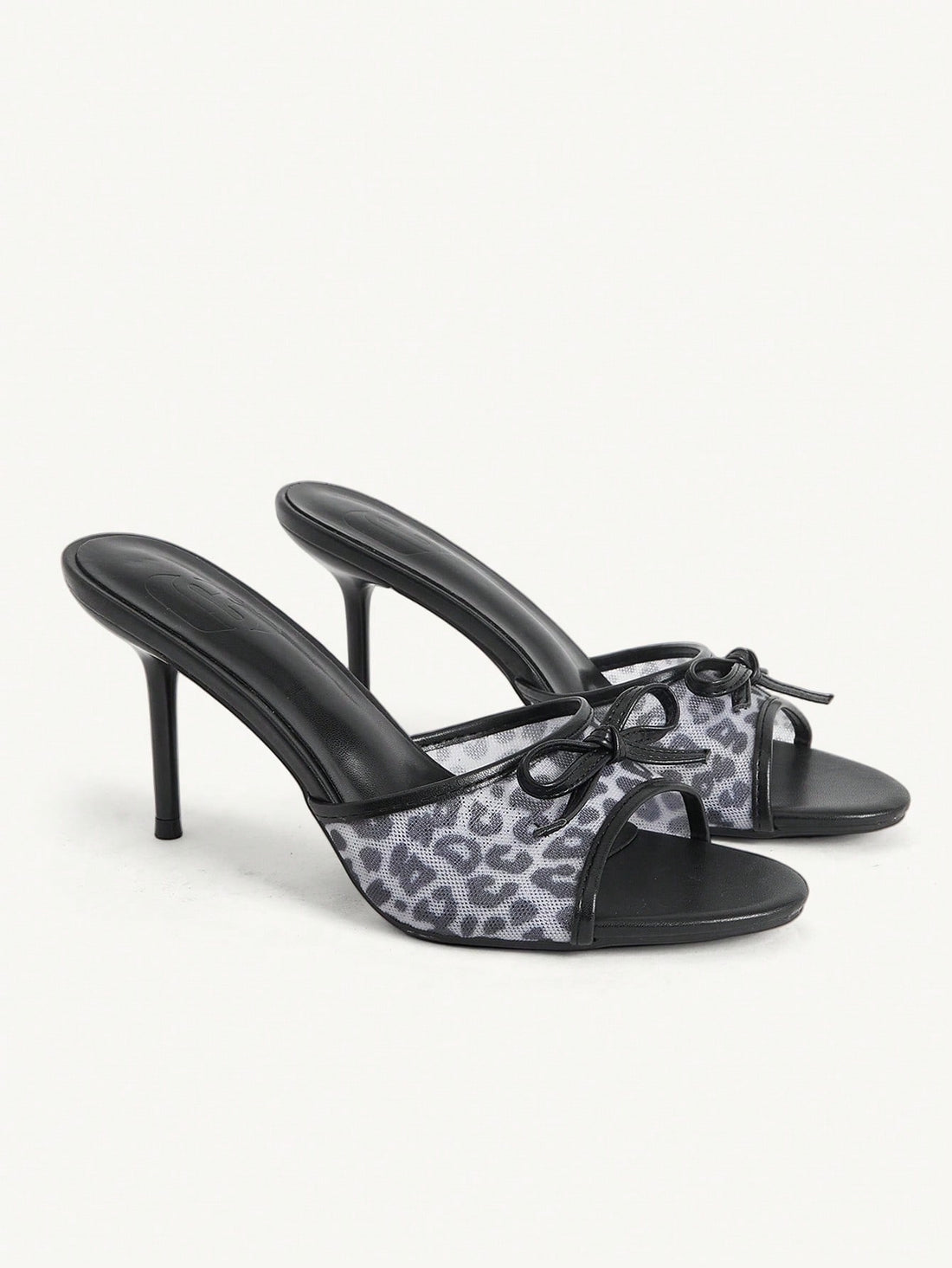 Women's open-toe leopard print mesh stiletto heeled sandals with bow detail.