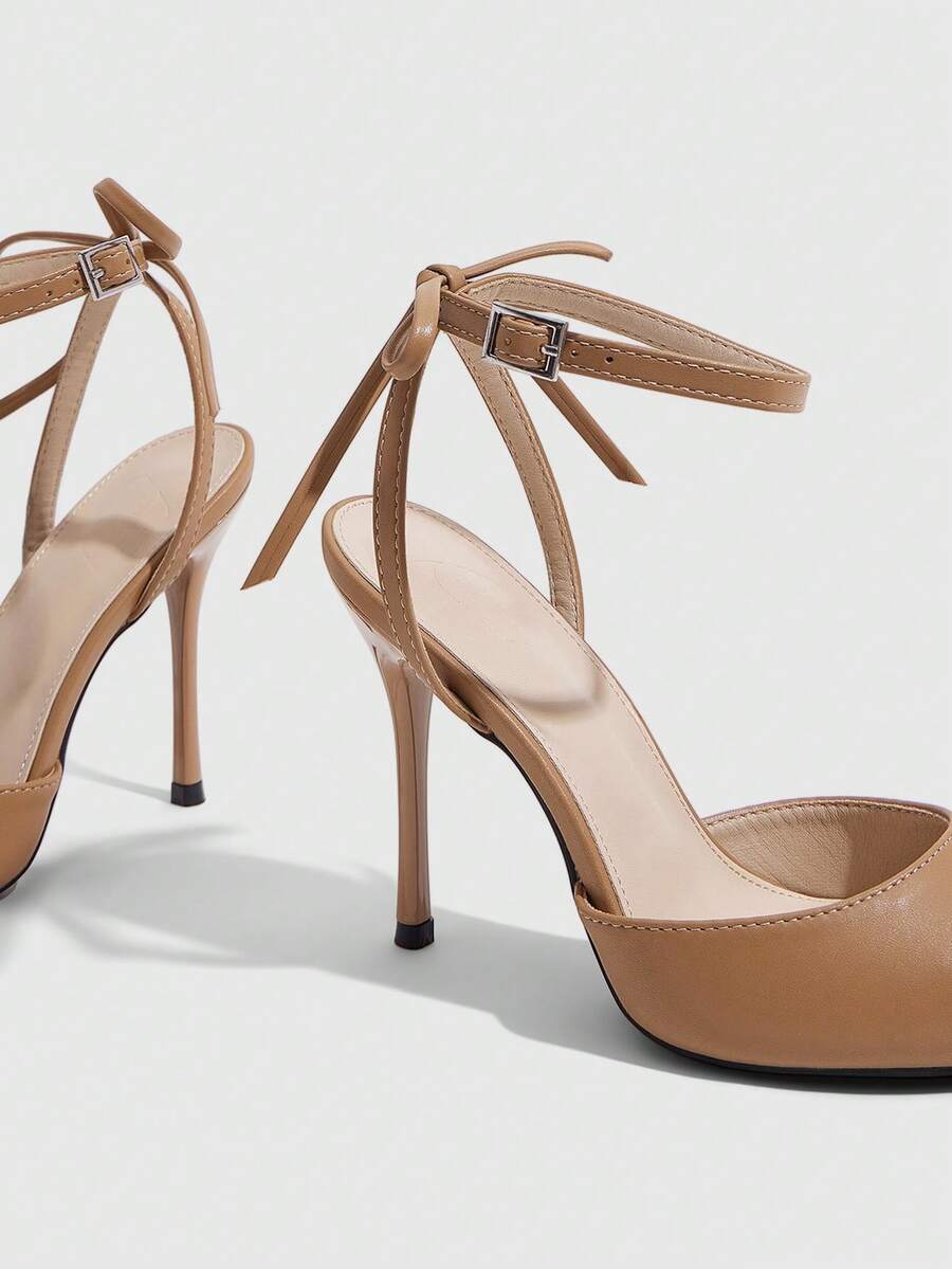 Women's pointed toe ankle strap stiletto high heel pumps featuring smooth PU leather and delicate buckle closure