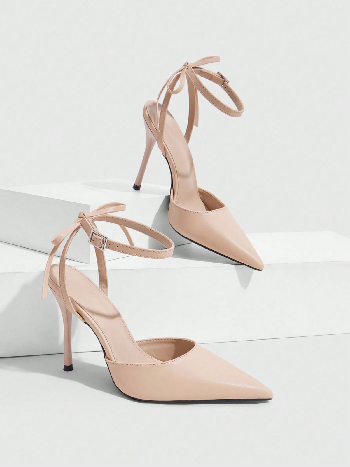 Women's pointed toe ankle strap stiletto high heel pumps featuring smooth PU leather and delicate buckle closure