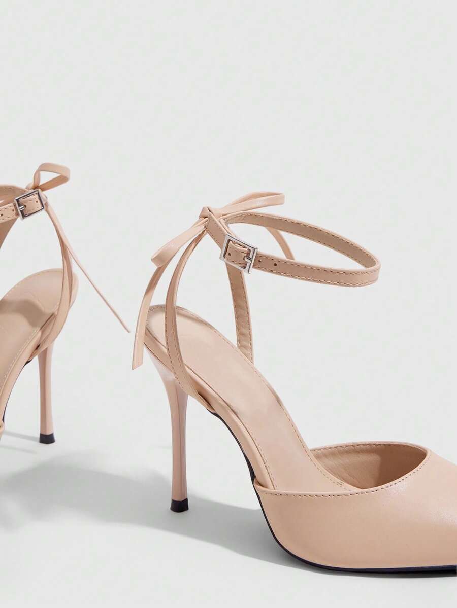 Women's pointed toe ankle strap stiletto high heel pumps featuring smooth PU leather and delicate buckle closure