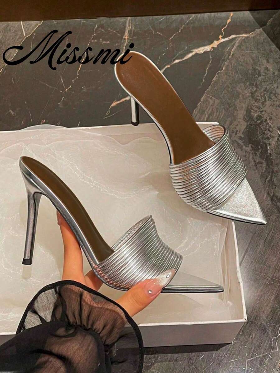 Women's pointed toe high heel mules with stiletto heels and slip-on strap design