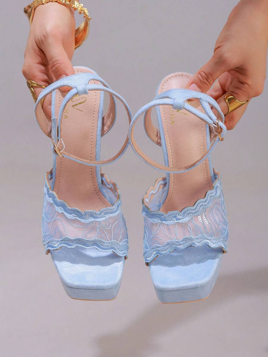 Lace embroidered open toe high heel sandals featuring a chunky square heel, platform wedge, and ankle strap buckle closure.
