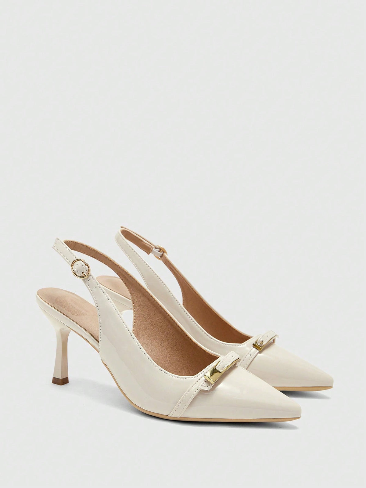 Beige pointed toe high heel pumps featuring a sleek stiletto heel and slingback strap for women.