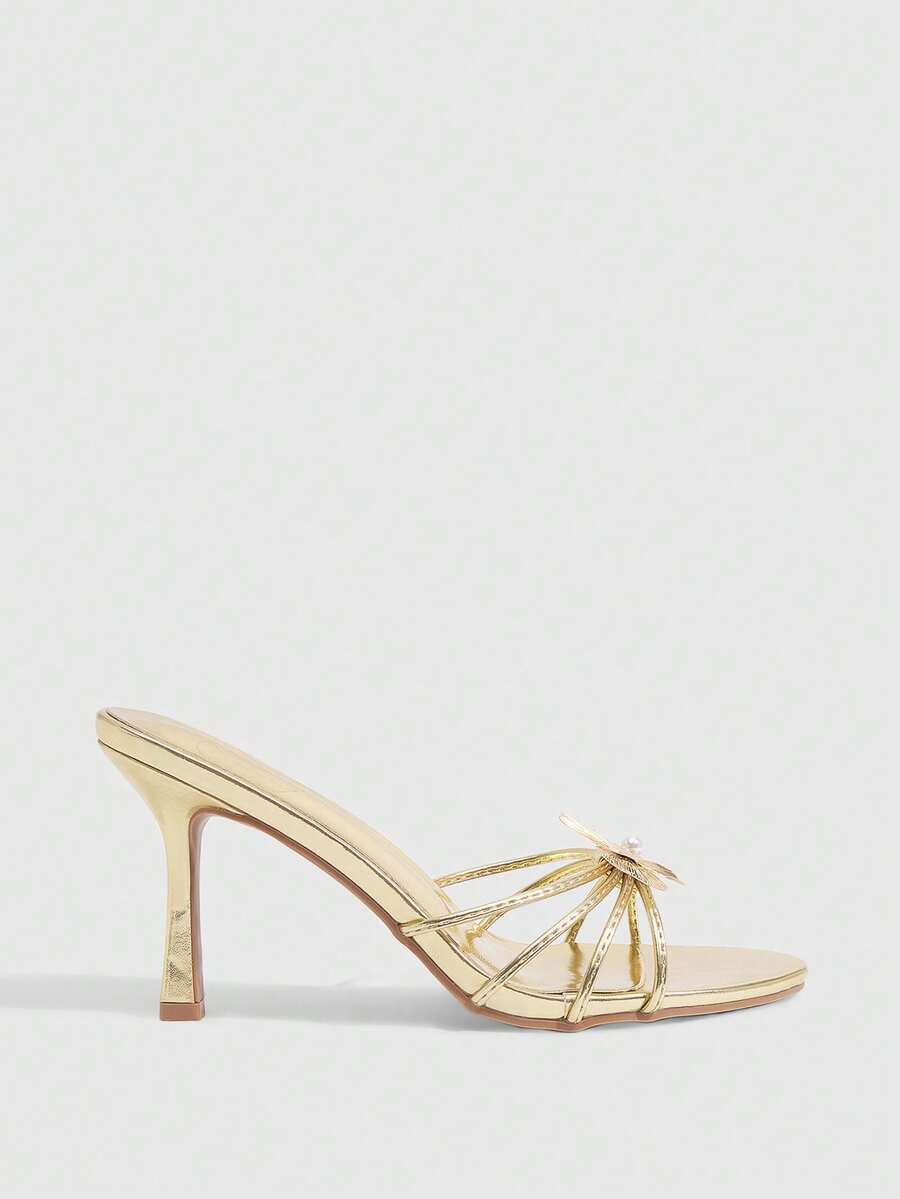 Square toe gold metallic heel sandals for women featuring open toe, crossover slingback strap, and stiletto mid heel for weddings and parties.