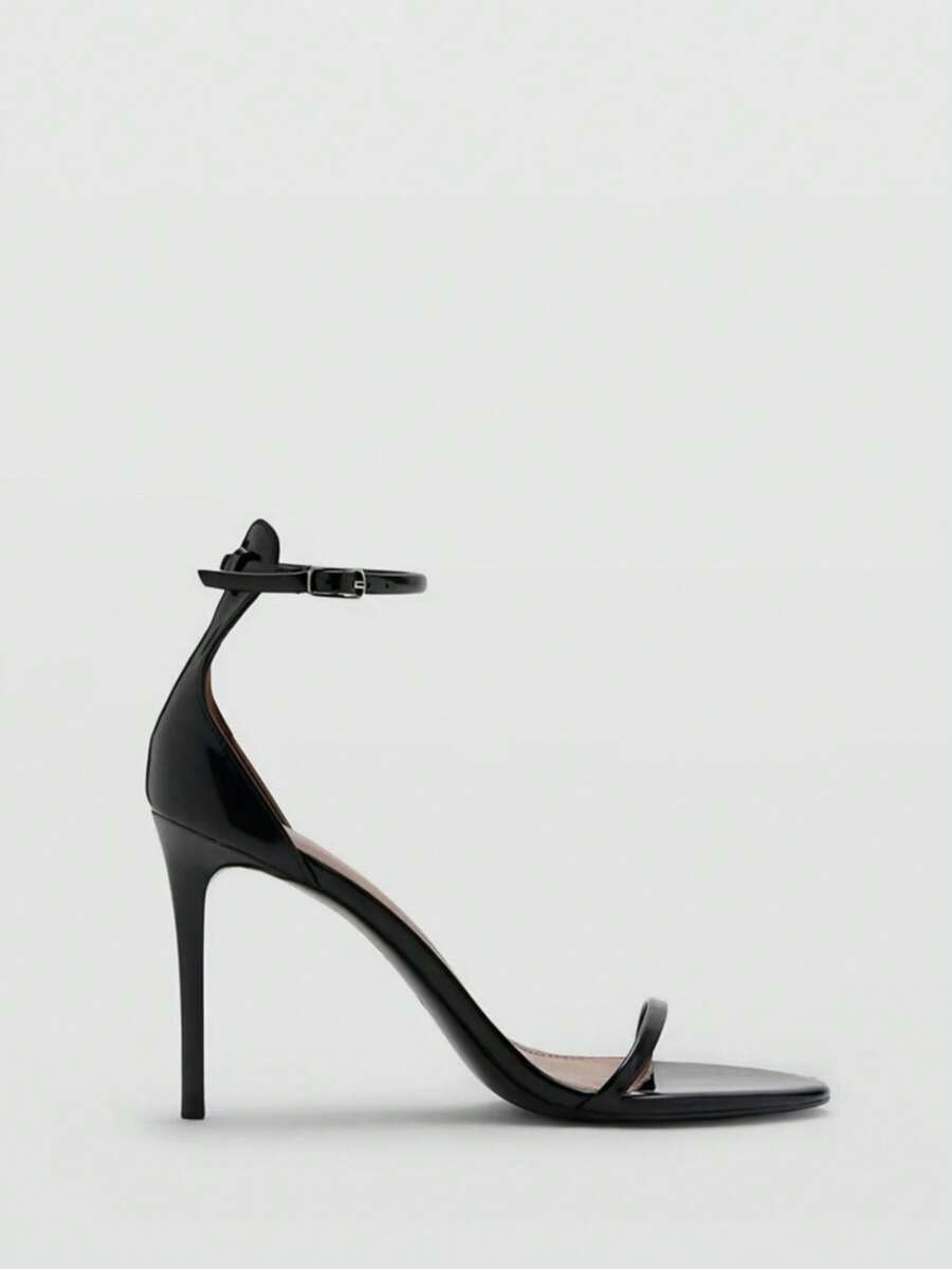 Women's open toe stiletto high heel sandals featuring metallic knot decor and an adjustable ankle buckle strap.