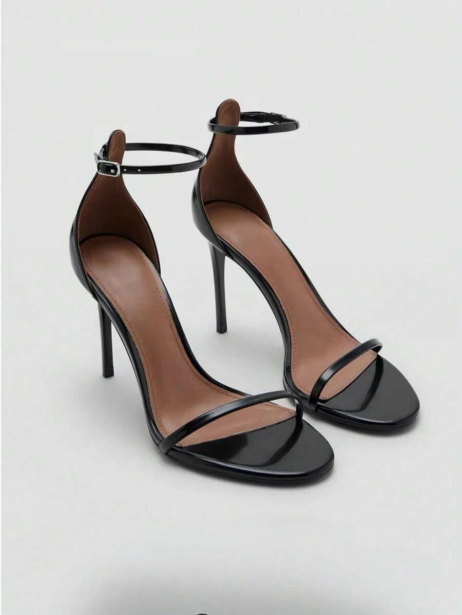 Women's open toe stiletto high heel sandals featuring metallic knot decor and an adjustable ankle buckle strap.