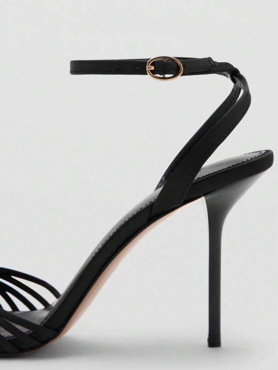 Women's open toe stiletto high heel sandals featuring metallic knot decor and an adjustable ankle buckle strap.
