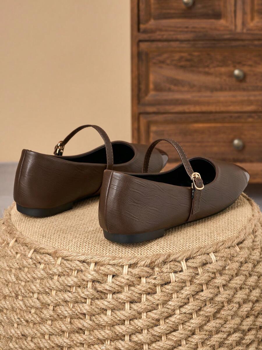 Pair of women's square toe slip-on flat shoes featuring a delicate bow detail and low vamp design.