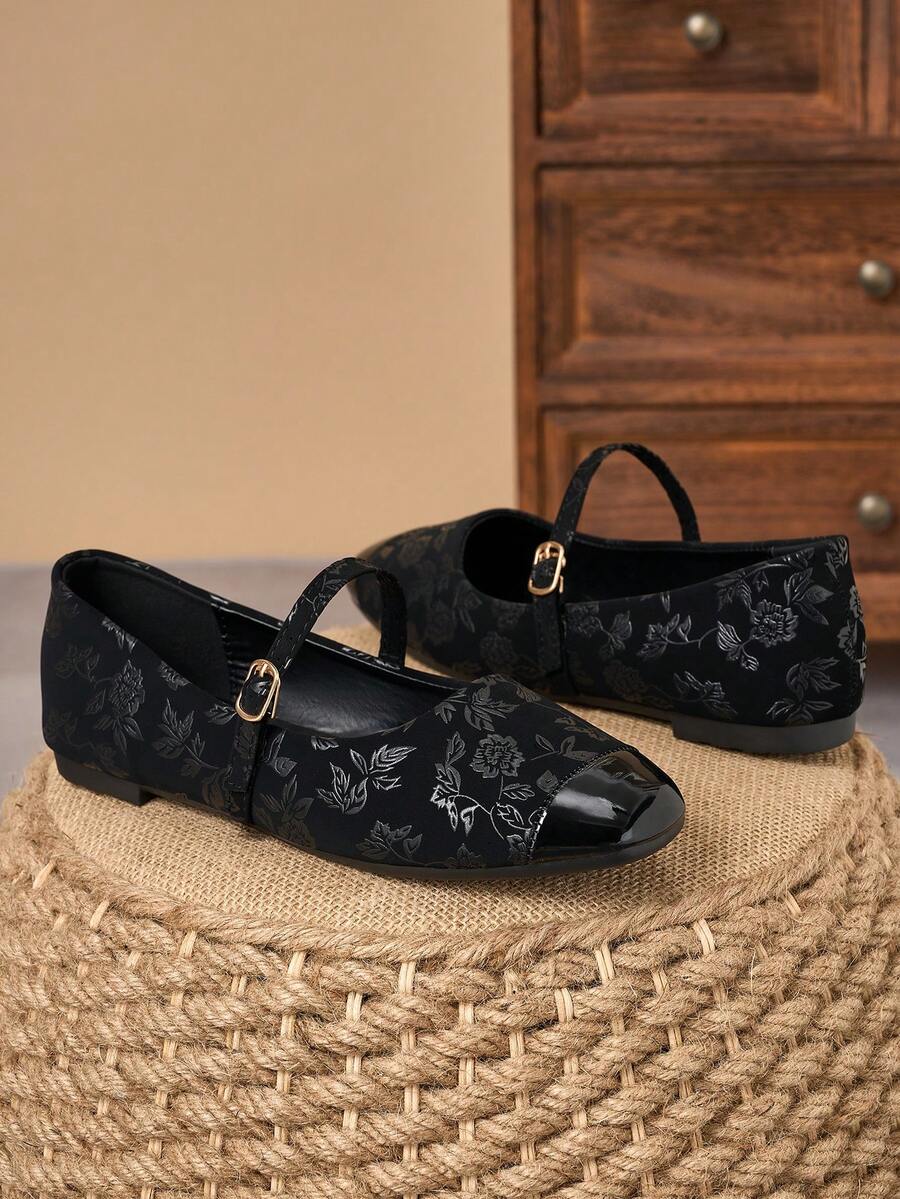 Pair of women's square toe slip-on flat shoes featuring a delicate bow detail and low vamp design.