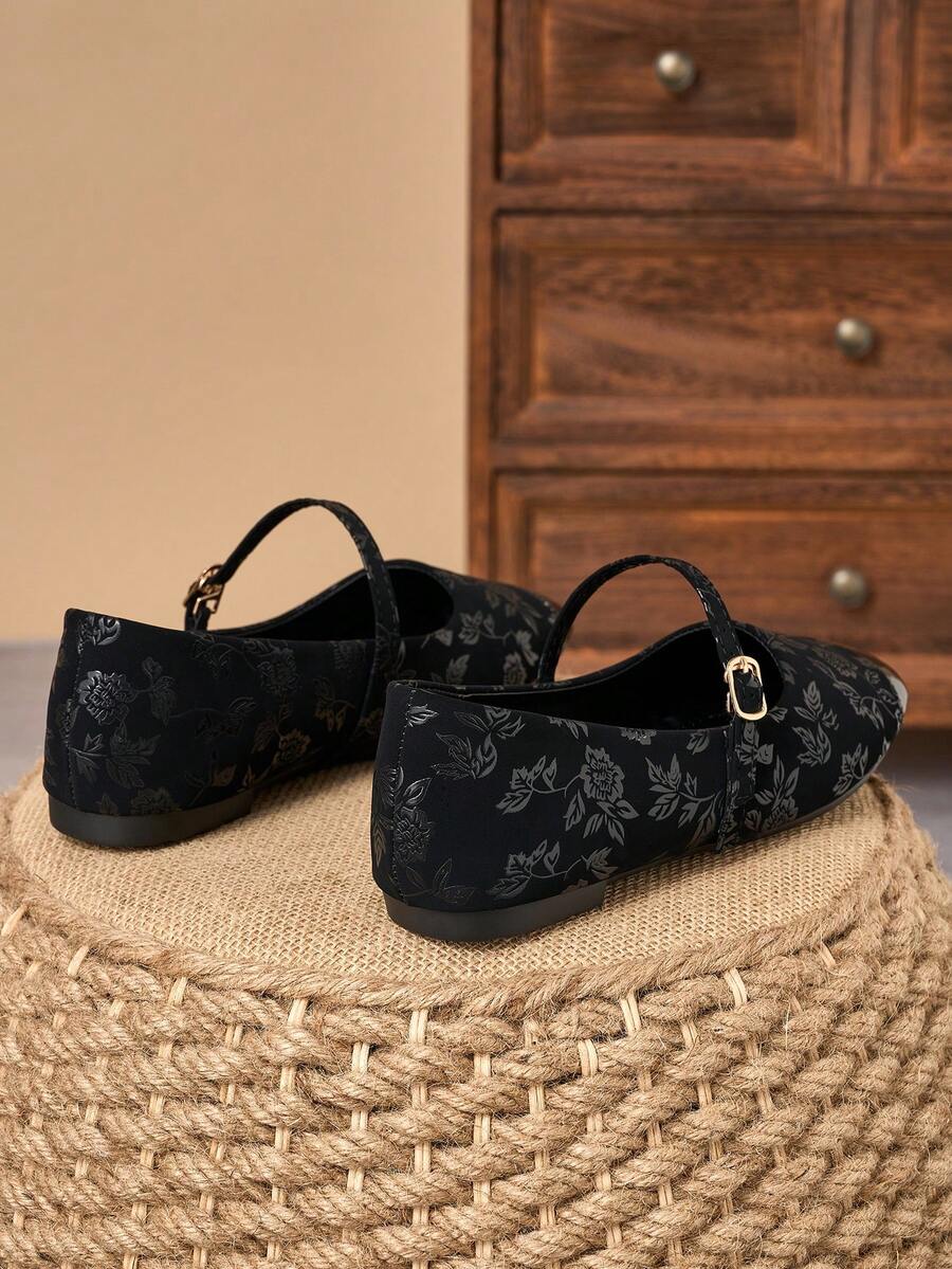 Pair of women's square toe slip-on flat shoes featuring a delicate bow detail and low vamp design.