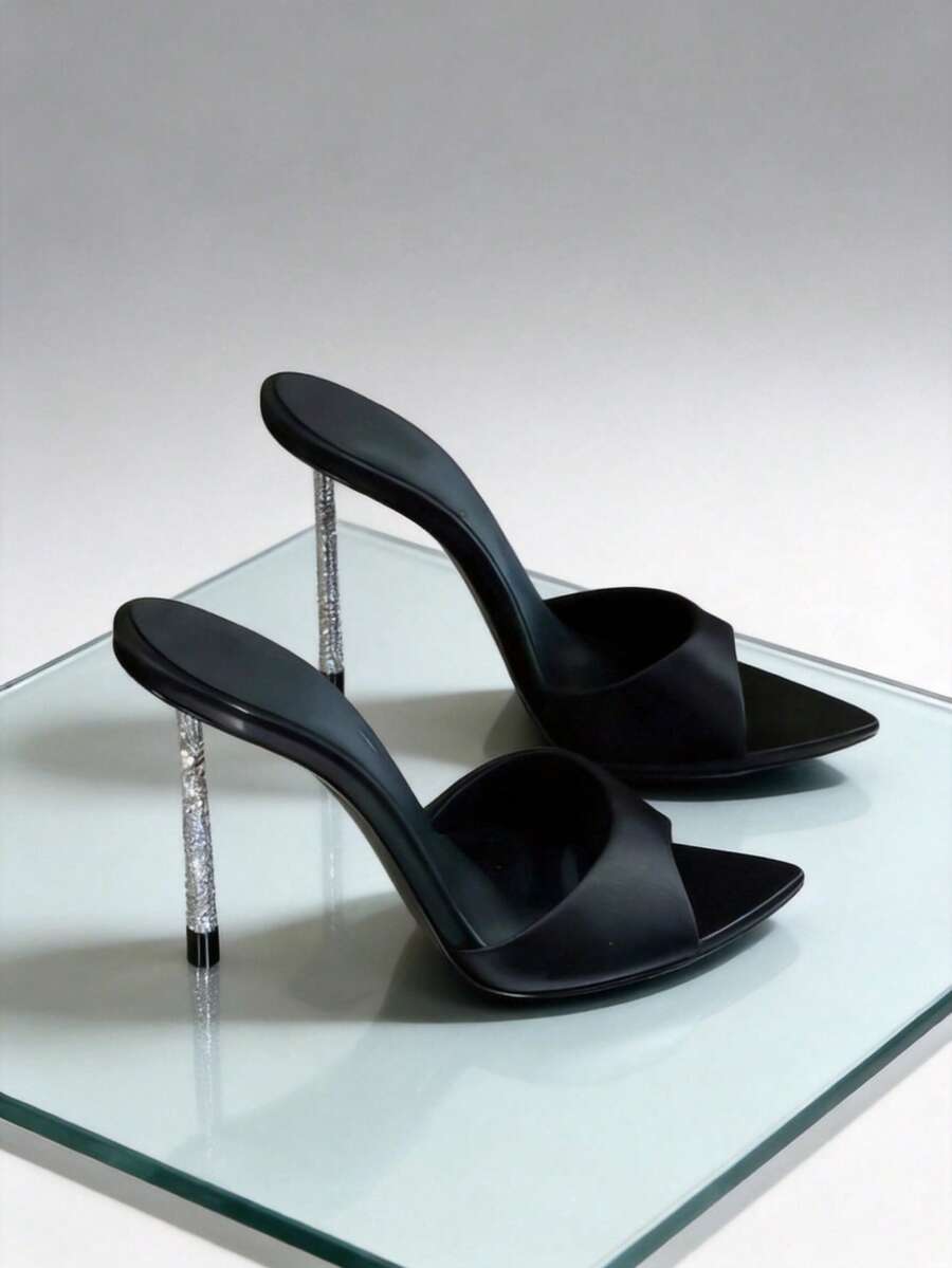 Women's black satin stiletto heeled sandals with sparkling rhinestone embellishments and a pointed peep toe design.