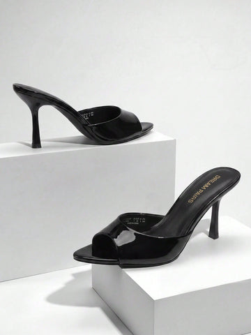 Women's pointed peep toe high heel sandals featuring a sleek stiletto heel, slip-on mule design, and smooth faux leather finish.