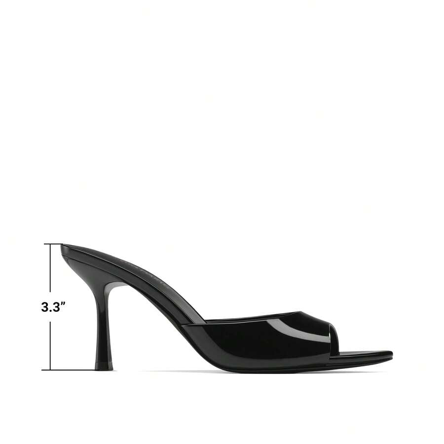 Women's pointed peep toe high heel sandals featuring a sleek stiletto heel, slip-on mule design, and smooth faux leather finish.