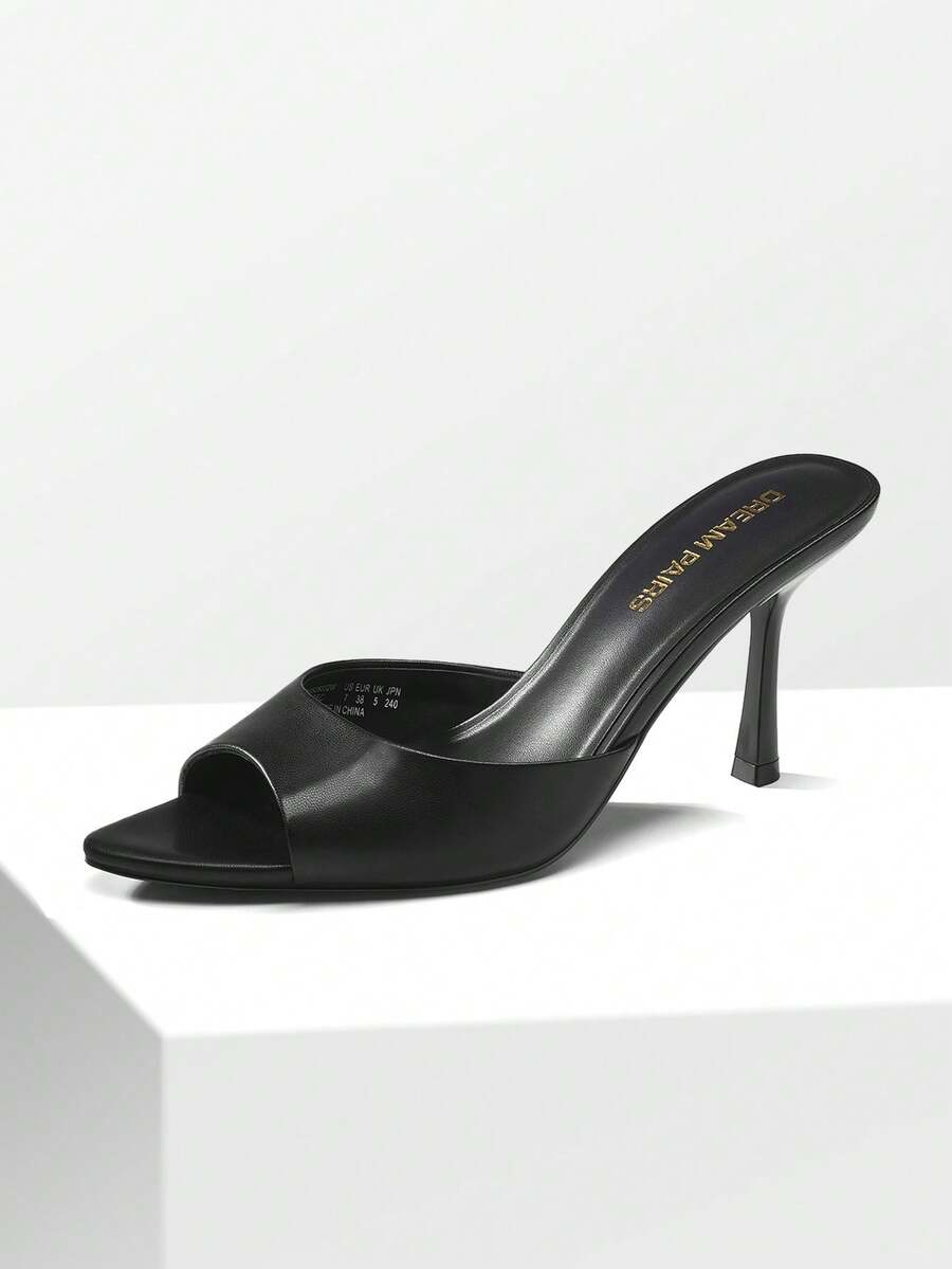 Women's pointed peep toe high heel sandals featuring a sleek stiletto heel, slip-on mule design, and smooth faux leather finish.