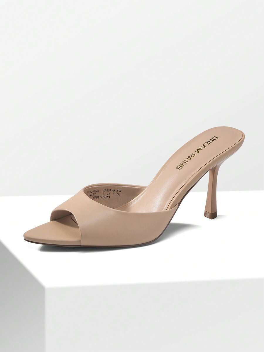 Women's pointed peep toe high heel sandals featuring a sleek stiletto heel, slip-on mule design, and smooth faux leather finish.