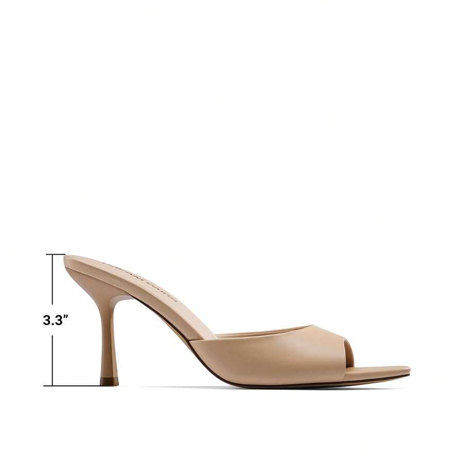 Women's pointed peep toe high heel sandals featuring a sleek stiletto heel, slip-on mule design, and smooth faux leather finish.