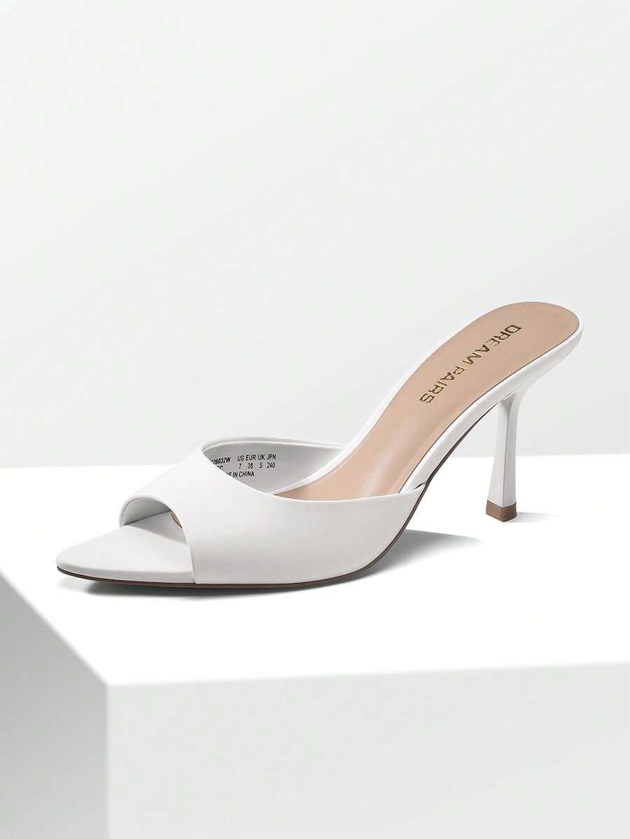 Women's pointed peep toe high heel sandals featuring a sleek stiletto heel, slip-on mule design, and smooth faux leather finish.