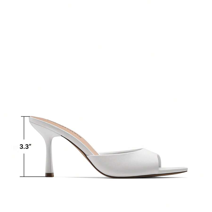 Women's pointed peep toe high heel sandals featuring a sleek stiletto heel, slip-on mule design, and smooth faux leather finish.