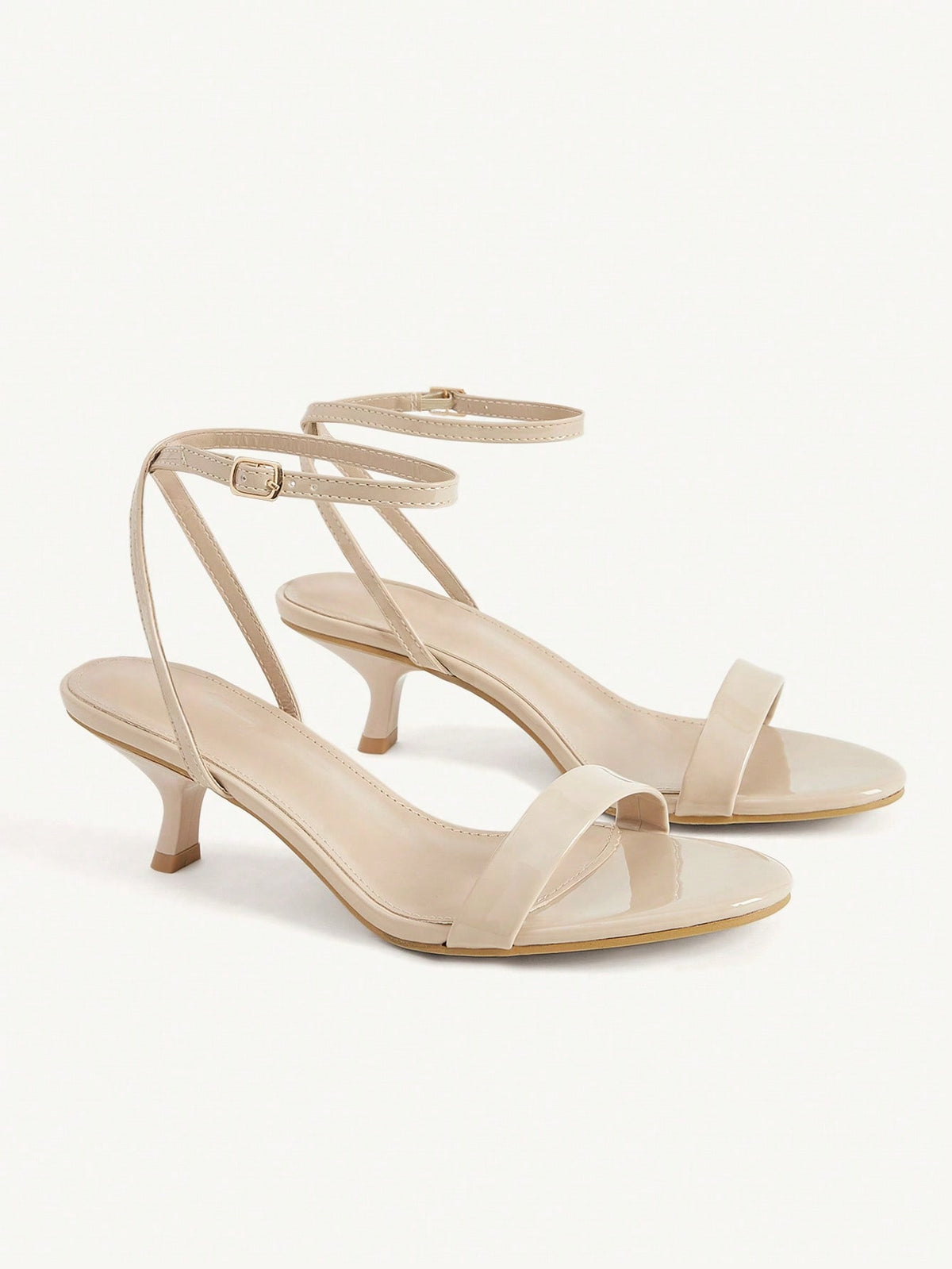 Women's open-toed high-heeled sandals featuring a 5.5cm kitten heel stiletto, sleek ankle strap with buckle closure, and smooth PU leather finish.