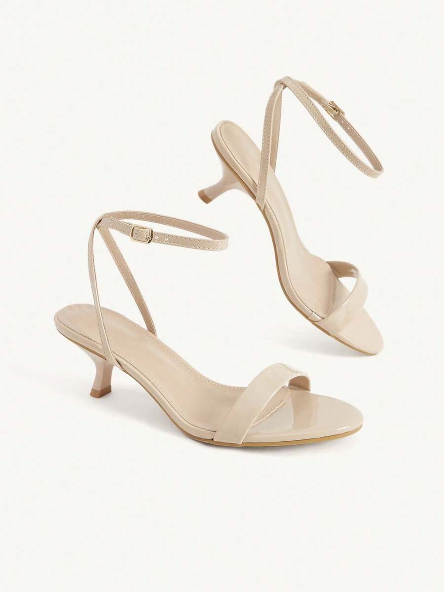 Women's open-toed high-heeled sandals featuring a 5.5cm kitten heel stiletto, sleek ankle strap with buckle closure, and smooth PU leather finish.