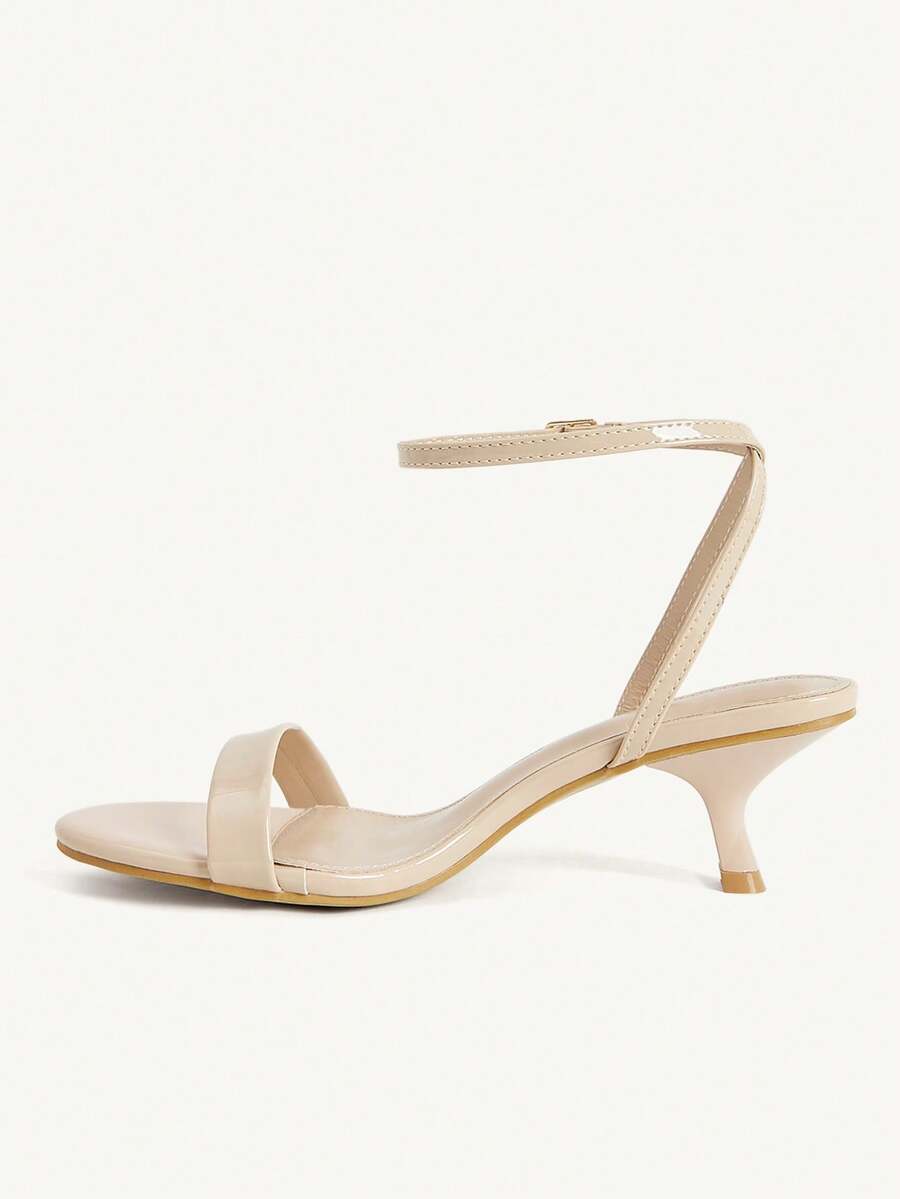 Women's open-toed high-heeled sandals featuring a 5.5cm kitten heel stiletto, sleek ankle strap with buckle closure, and smooth PU leather finish.