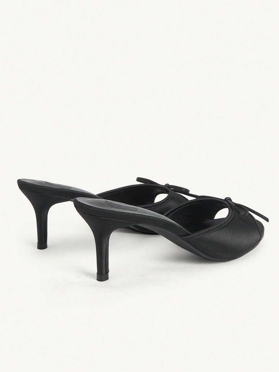 Women's black open-toe stiletto mule high heel sandals with bow detail