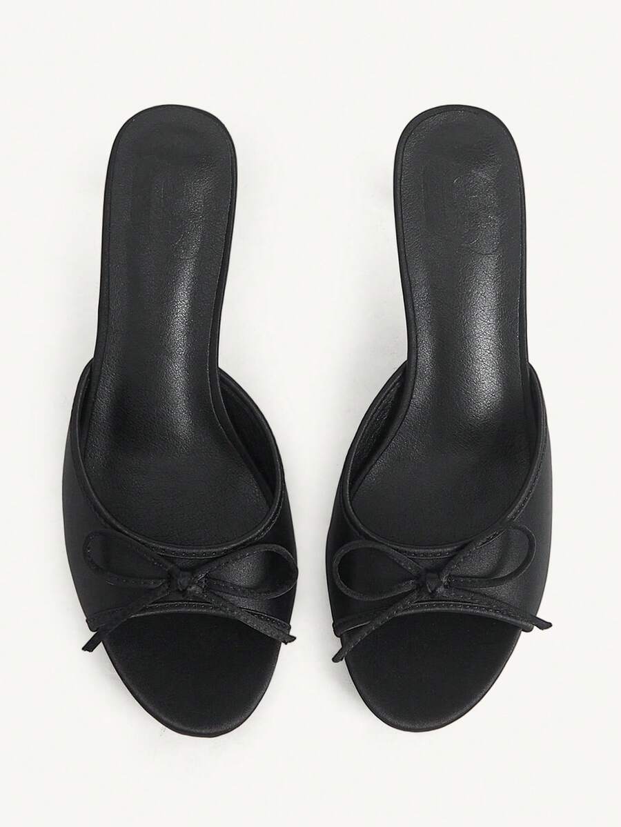 Women's black open-toe stiletto mule high heel sandals with bow detail
