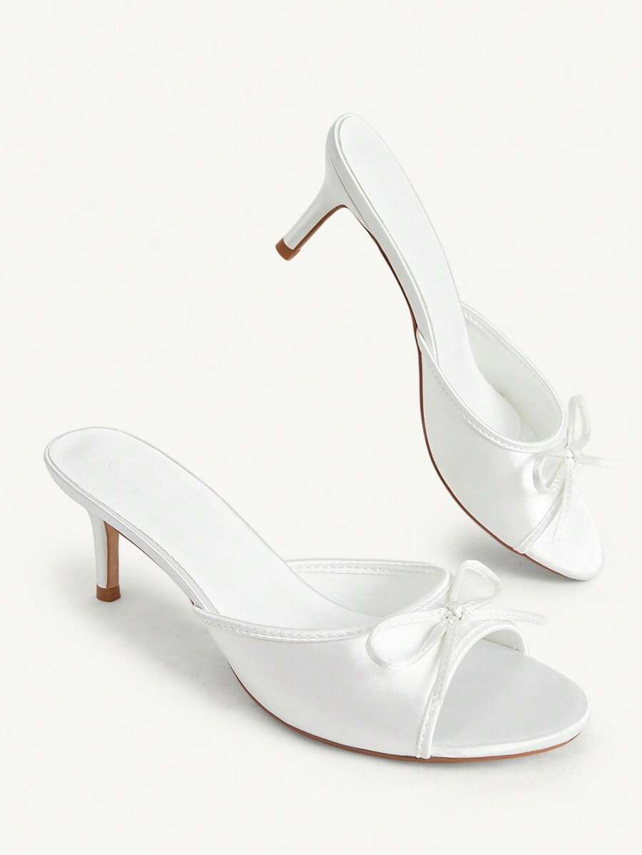 Women's black open-toe stiletto mule high heel sandals with bow detail