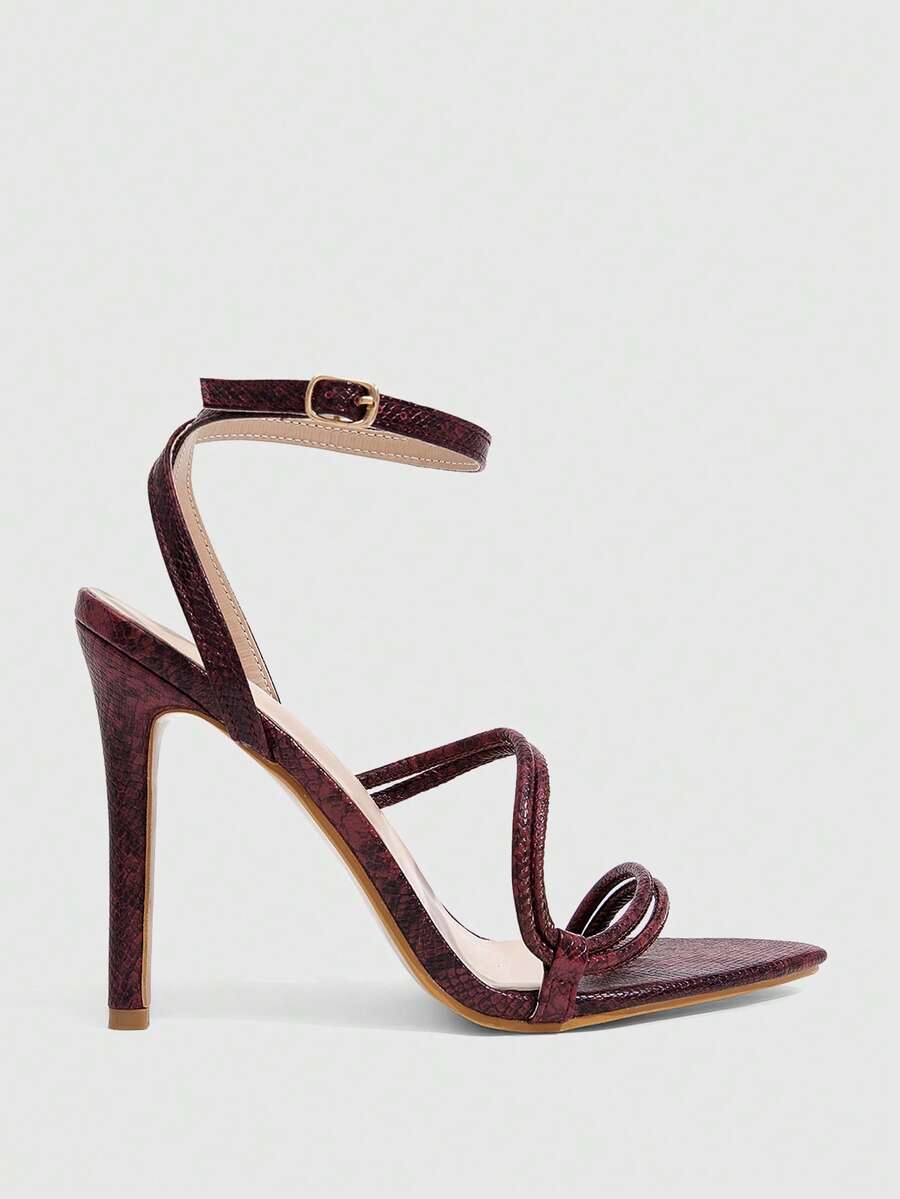 Snake pattern open toe high heel sandals with thin stiletto heel and buckle ankle strap for women.