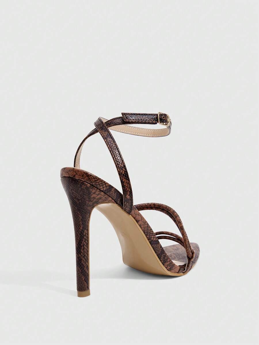 Snake pattern open toe high heel sandals with thin stiletto heel and buckle ankle strap for women.