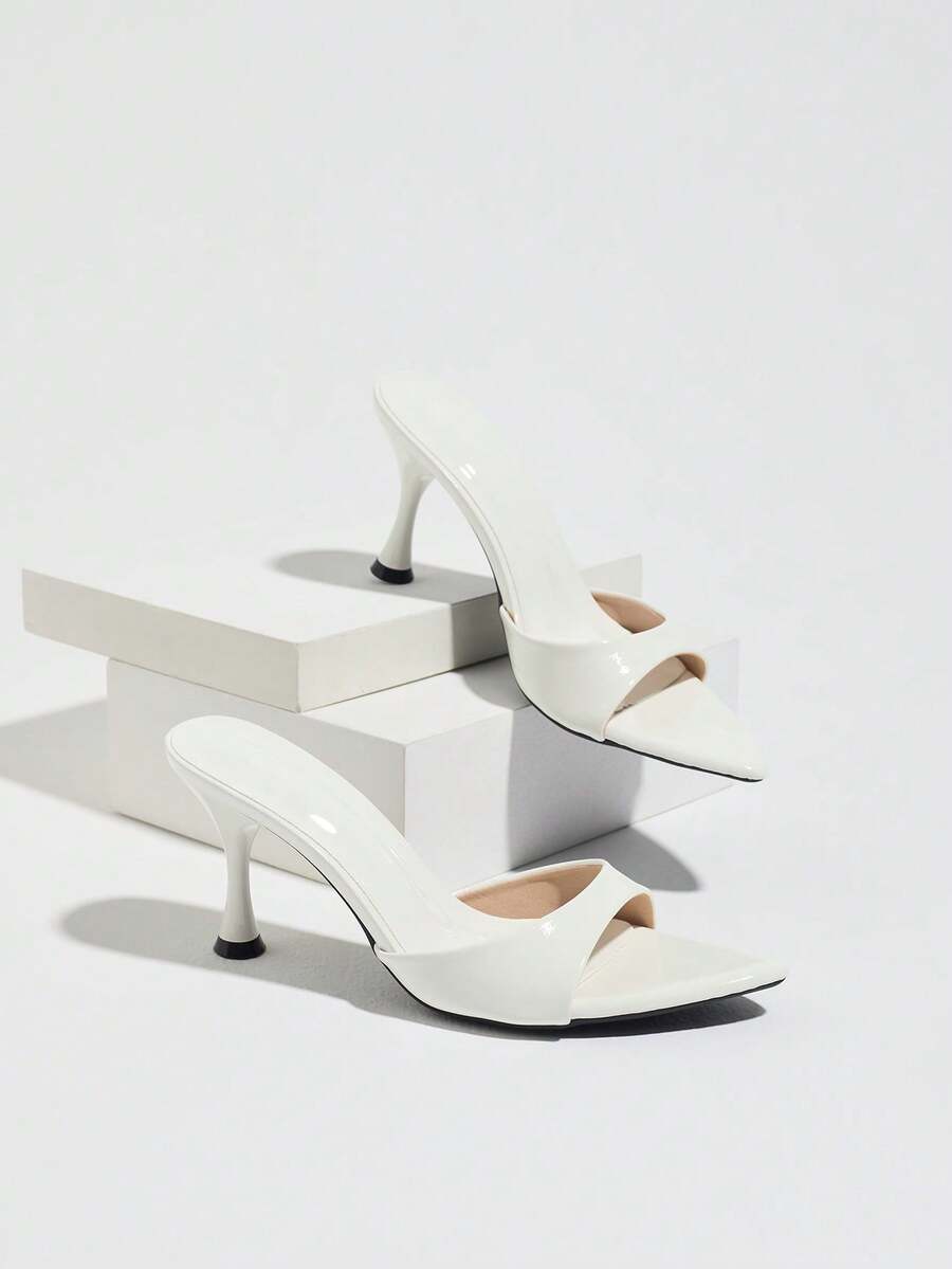 Women's open pointed toe stiletto mule high heel sandals featuring a glossy slip-on design.