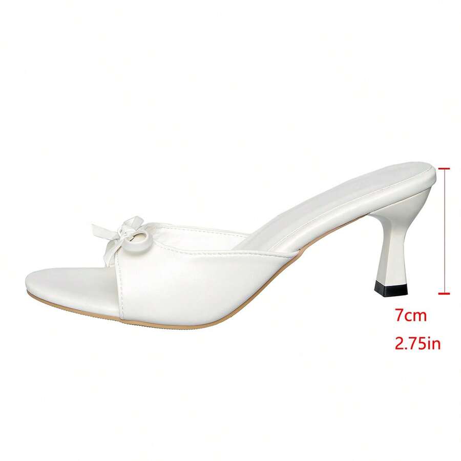 Women's open toe stiletto sandals in PU leather featuring slip-on slingback straps and bow accents for summer parties