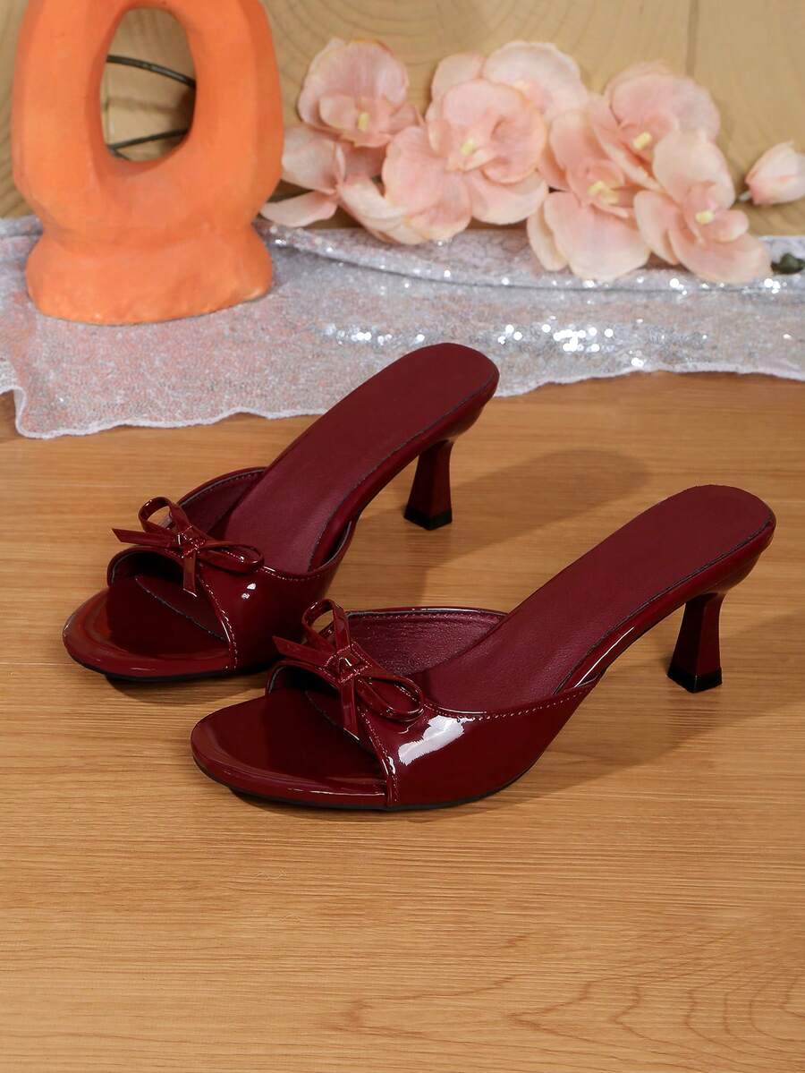 Women's open toe stiletto sandals in PU leather featuring slip-on slingback straps and bow accents for summer parties