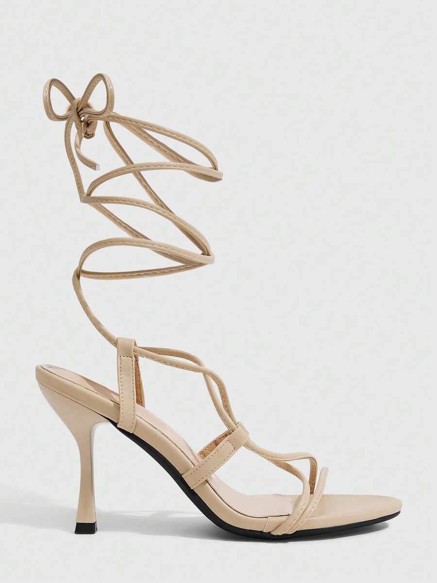 Women's open toe stiletto high heel sandals with criss cross straps and sleek PU leather finish