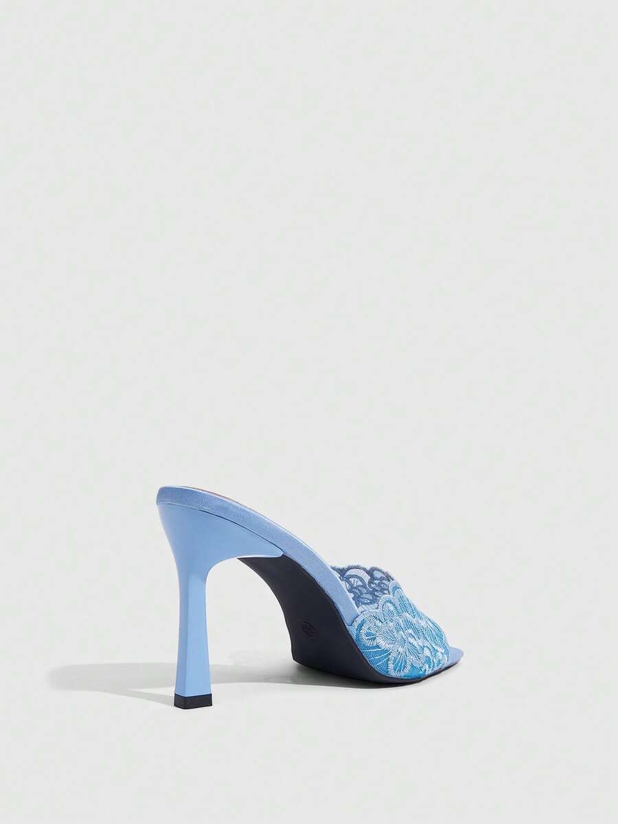 Women's square toe stiletto high heel slide sandals featuring contrast mesh embroidery and an open-toe backless design.