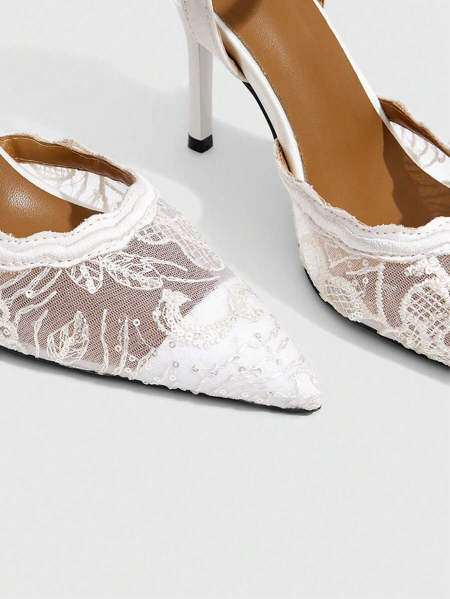 Women's stiletto high heel shoes featuring an elegant buckle detail and ankle strap slingback design.