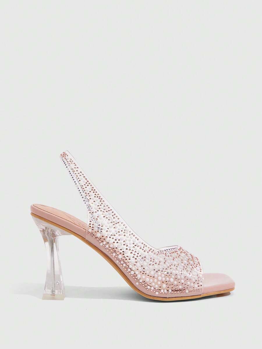 Women's square toe heeled sandals with clear straps, sparkling rhinestone embellishments, and a high pyramid heel.
