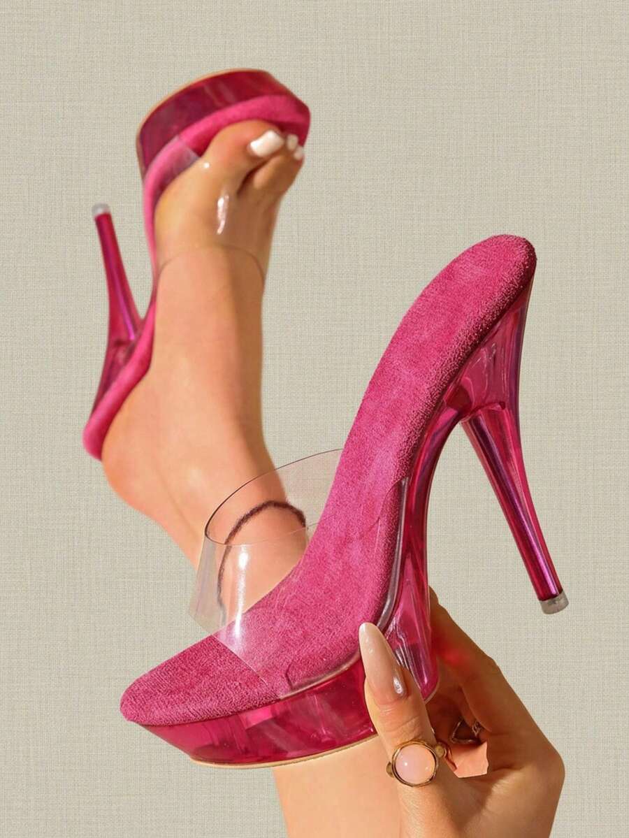 Transparent chunky heel platform slide sandals for women featuring clear PVC upper, open toe design, and ultra high heels.