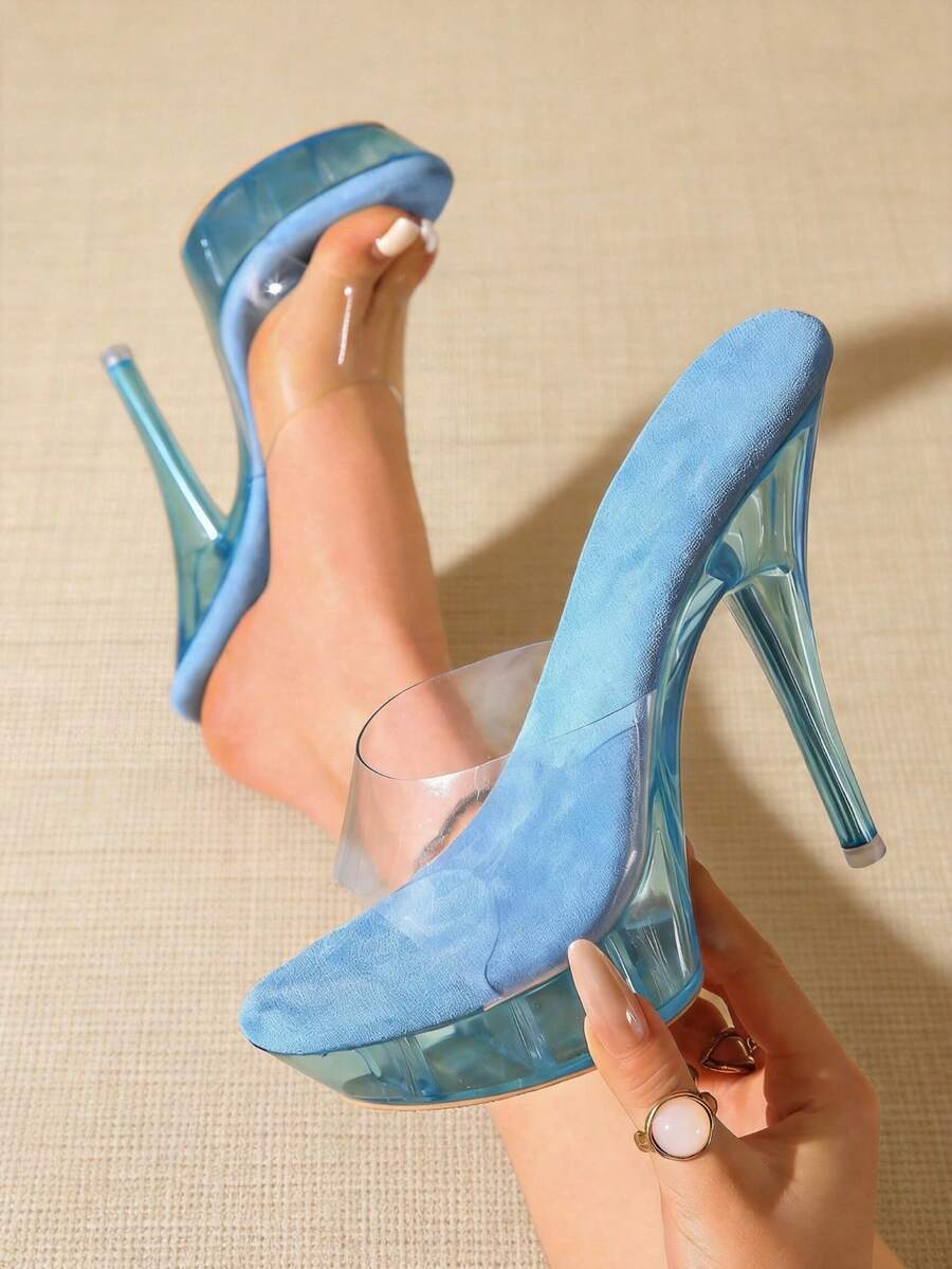Transparent chunky heel platform slide sandals for women featuring clear PVC upper, open toe design, and ultra high heels.