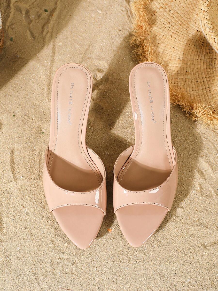 Women's open toe slide sandals featuring sleek patent leather and thin stiletto heels