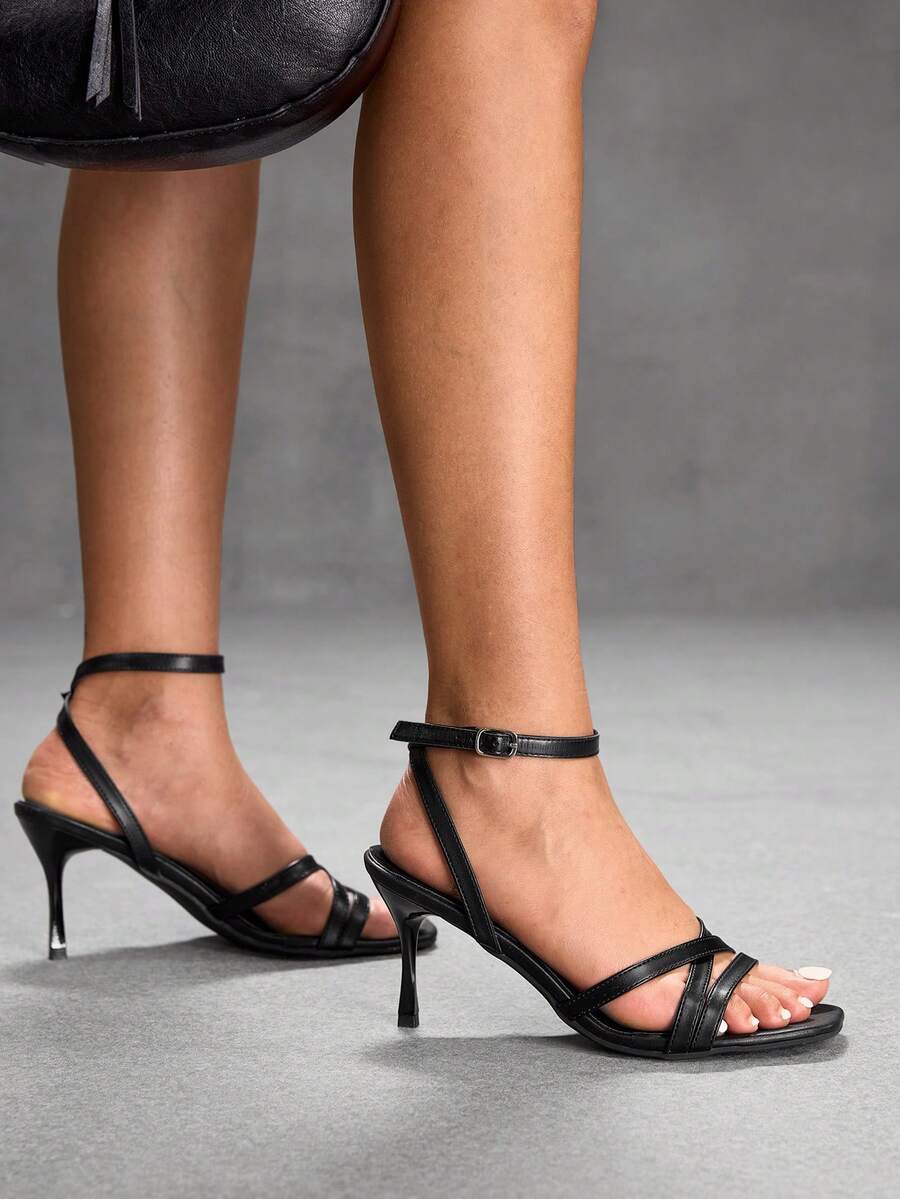 Square toe stiletto high heel sandals with crisscross strappy design and adjustable ankle buckle strap in light blue.