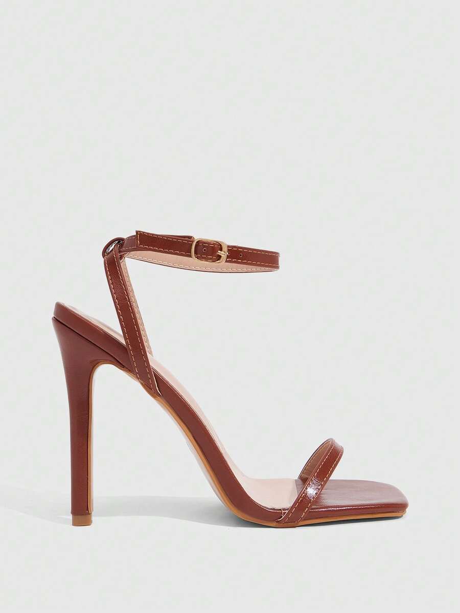 Elegant women's open toe strappy heeled sandals with stiletto high heel and ankle strap buckle closure.