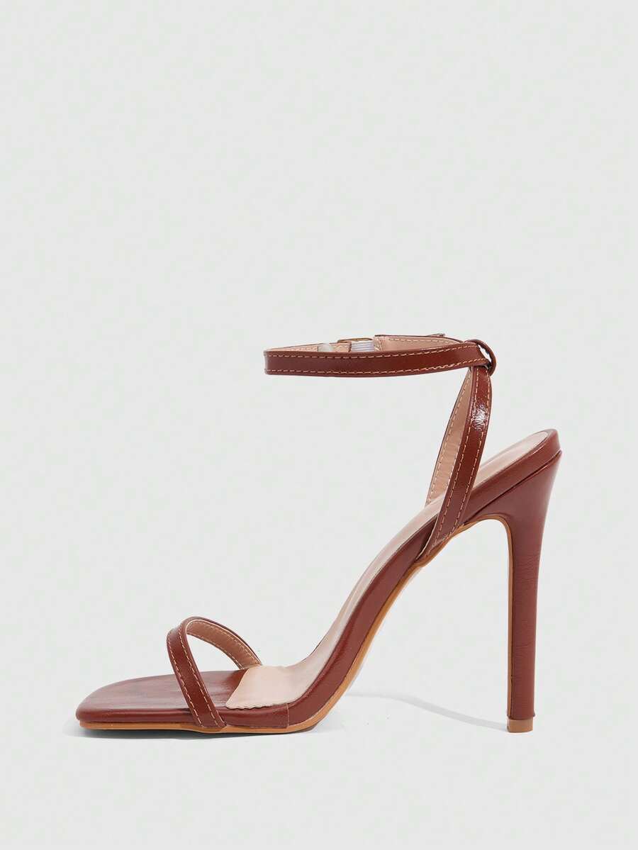 Elegant women's open toe strappy heeled sandals with stiletto high heel and ankle strap buckle closure.