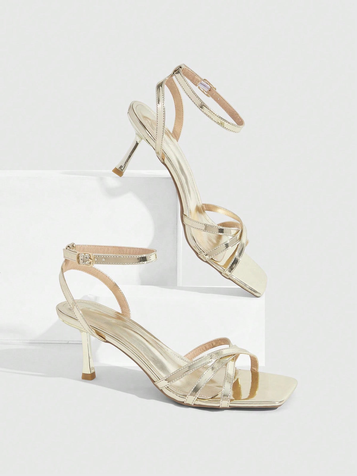 Women's open toe stiletto heel sandals featuring square toe design, criss-cross rhinestone slim straps, and secure ankle strap.