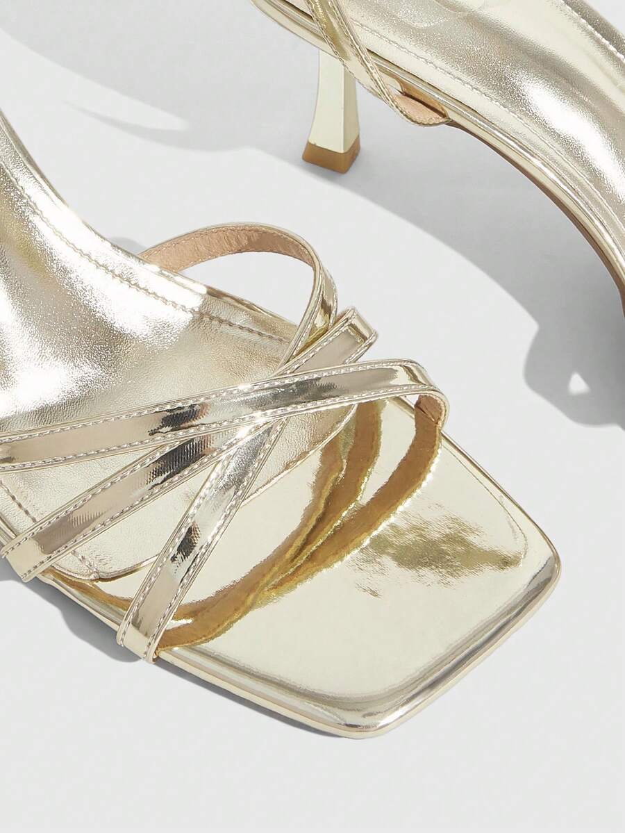 Women's open toe stiletto heel sandals featuring square toe design, criss-cross rhinestone slim straps, and secure ankle strap.